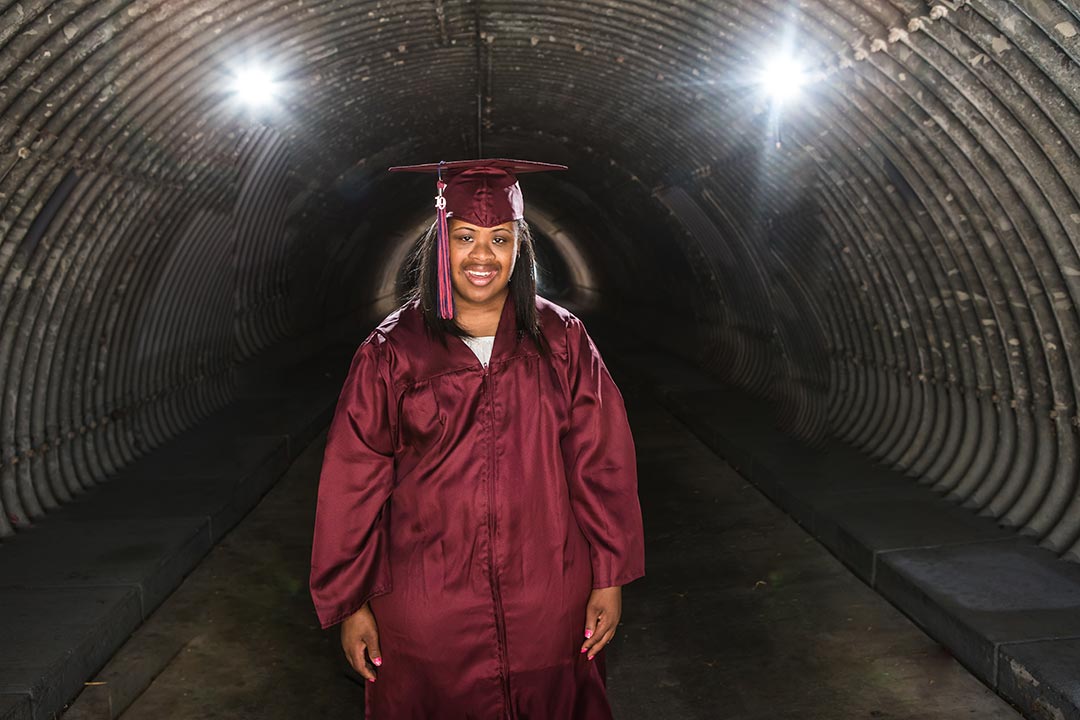 Senior Portraits show a recent graduate in cap and gown